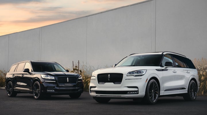 Two Lincoln Aviator® SUVs are shown with the available Jet Appearance Package | Northgate Lincoln in Port Huron MI