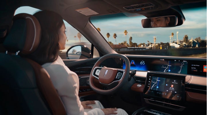 A person is shown driving hands-free on the highway with available Lincoln BlueCruise technology. | Northgate Lincoln in Port Huron MI