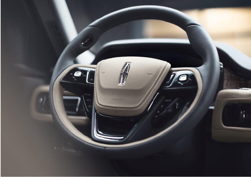 The intuitively placed controls of the steering wheel on a 2023 Lincoln Aviator® SUV | Northgate Lincoln in Port Huron MI