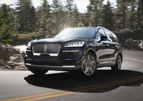 A Lincoln Aviator® SUV is being driven on a winding mountain road | Northgate Lincoln in Port Huron MI