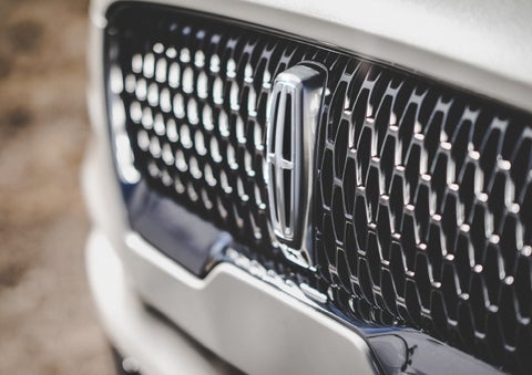 The grille of the 2024 Lincoln Aviator® Reserve model with an eye-catching repeated field of Lincoln Star logo shapes | Northgate Lincoln in Port Huron MI