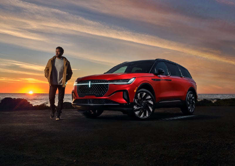 A person is shown next to a 2025 Lincoln Nautilus® SUV as the Lincoln Embrace sequence takes place. | Northgate Lincoln in Port Huron MI