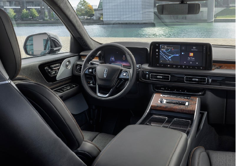 The interior of the 2026 Lincoln Aviator® SUV is shown parked with a view of a harbor through the windshield. | Northgate Lincoln in Port Huron MI
