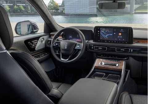 The interior of the 2026 Lincoln Aviator® SUV is shown parked with a view of a harbor through the windshield. | Northgate Lincoln in Port Huron MI