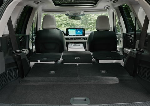 A rear to front view of the interior of a 2027 Lincoln Aviator® Black Label™ SUV shows the third and second rows folded flat | Northgate Lincoln in Port Huron MI